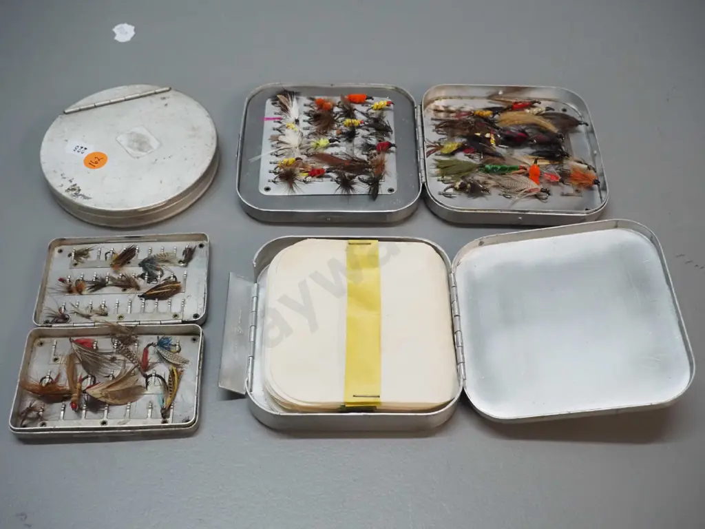 4 aluminium fishing fly containers - 2 with contents, 2 empty, no maker's marks. Largest is 110 x 110 Image 1++