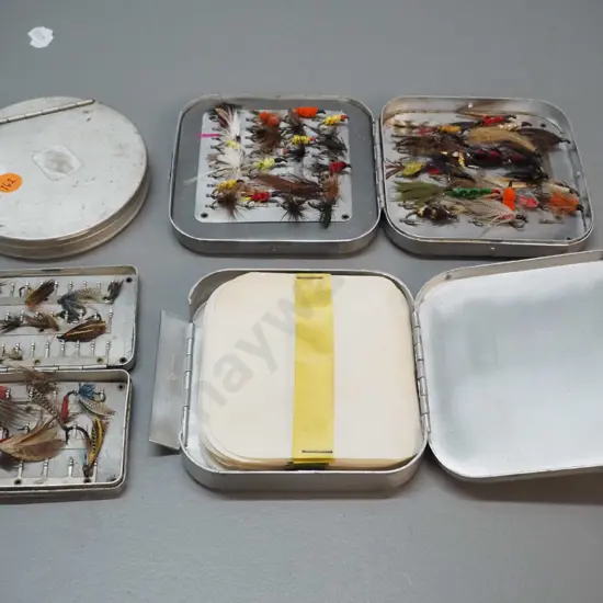 4 aluminium fishing fly containers - 2 with contents, 2 empty, no maker's marks. Largest is 110 x 110