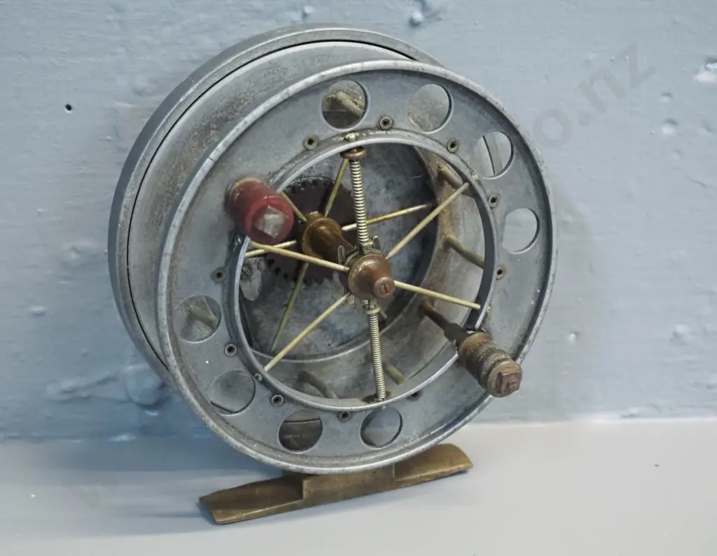 aluminium & brass aerial fishing reel marked Allcocks Redditch 4 1/2 inch - one timber knob missing - diameter 120 Image 1++