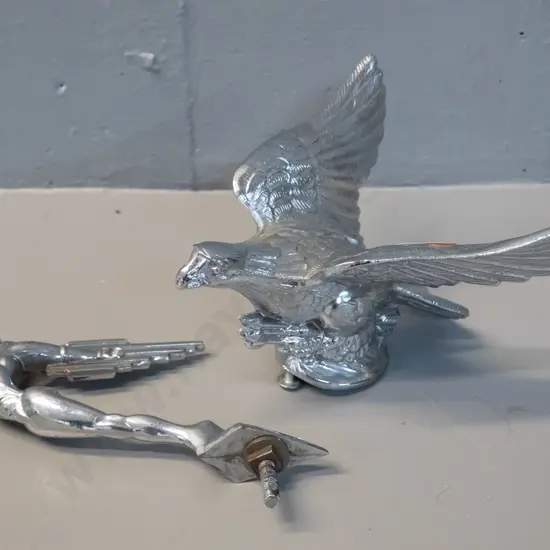 2 car mascots - one figural, one eagle holding arrows in talons H-90 W-160