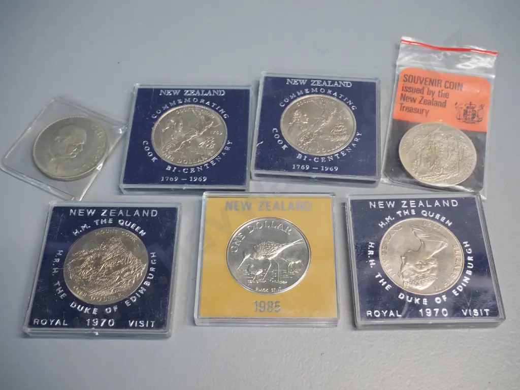 assorted New Zealand uncirculated coin sets, commemorative dollars and a 1965 English Churchill coin Image 1++