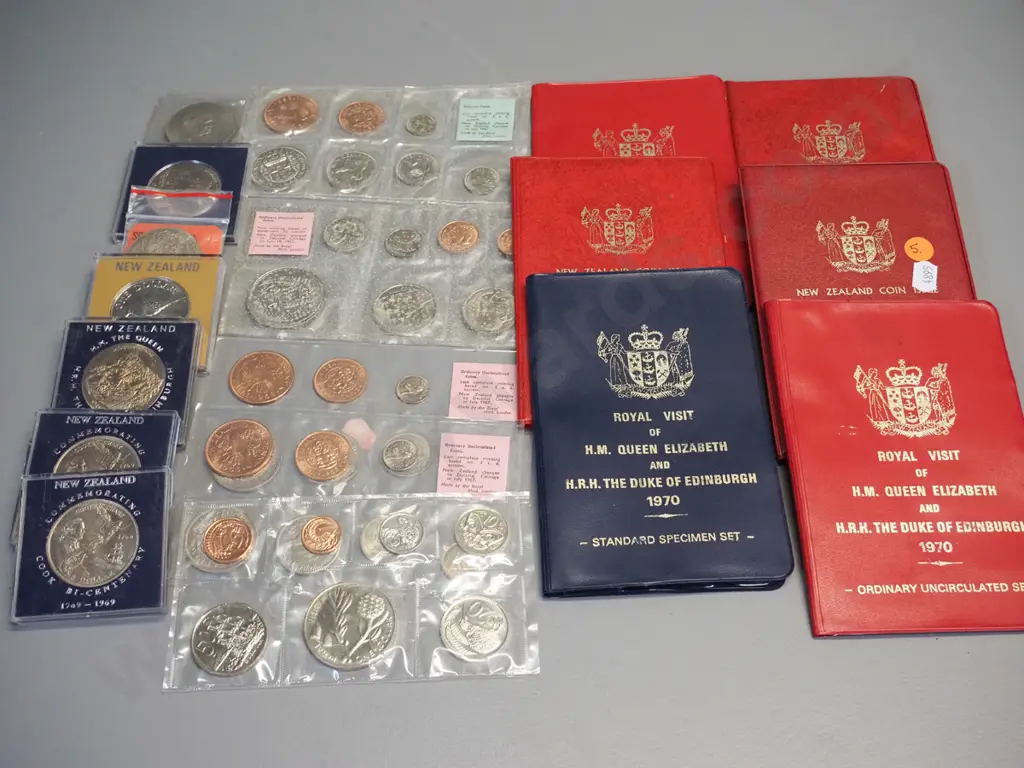 assorted New Zealand uncirculated coin sets, commemorative dollars and a 1965 English Churchill coin Image 1++