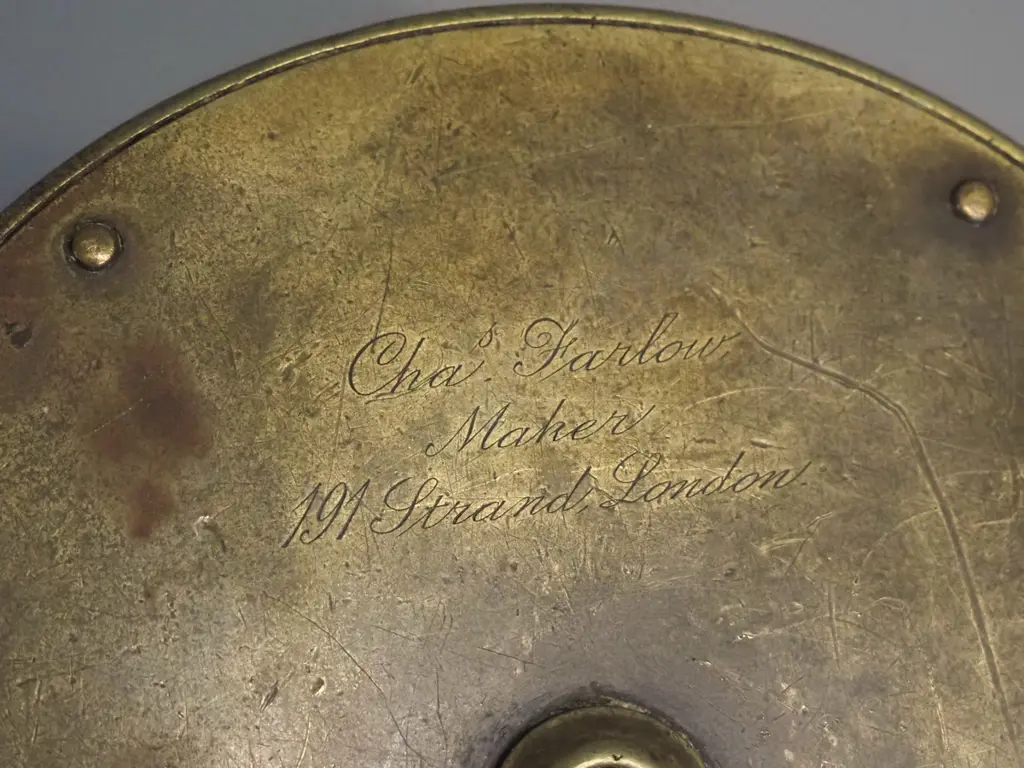 brass fishing reel with (bone?) knob, marked Chas Farlow 191 Strand London, circa 1880 according to note D-115 Image 1++