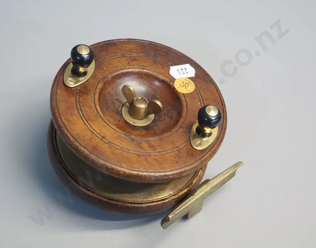 timber and brass fishing reel marked Heatons Triple Life - w/bakelite knobs. Diameter 115 Image 1++