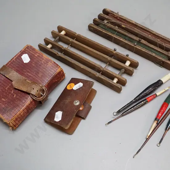 two vintage timber fishing line winders L180 W65 with assorted floats, and 2 leather fly wallets, smaller one with flies