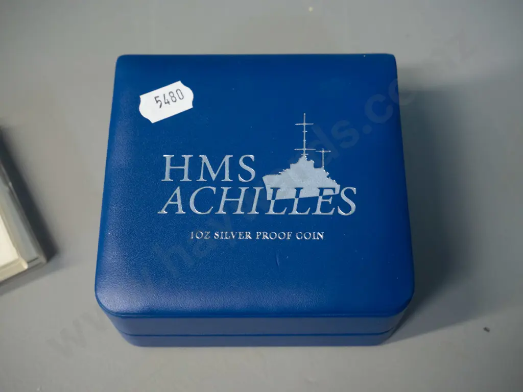 cased 2014 HMS Achilles commemorative silver proof dollar and two 1974 NZ Commonwealth Games Image 1++