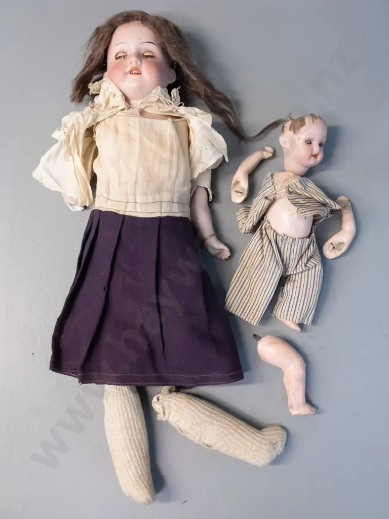 2 antique porcelain dolls - limbs seperated, one has broken arm, smaller one missing top of head. Larger is H-400 Image 1++