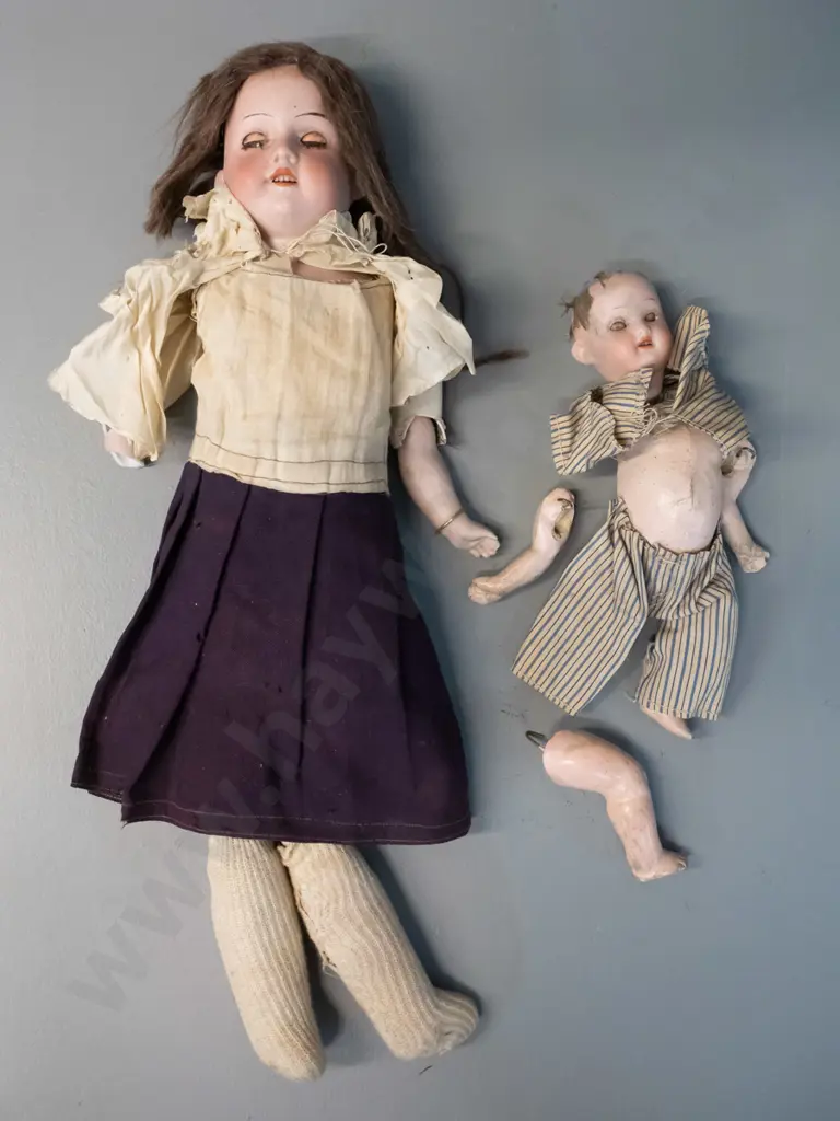 2 antique porcelain dolls - limbs seperated, one has broken arm, smaller one missing top of head. Larger is H-400 Image 1++