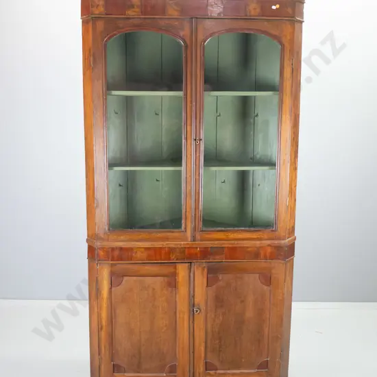 antique oak corner cabinet with 2 solid lower and 2 glazed upper doors, mixed timber veneer border at top, with key