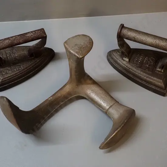 cast iron items - 2 sad irons - one marked Calvin Foundry H110 L160, other Silvesters - and a shoe last