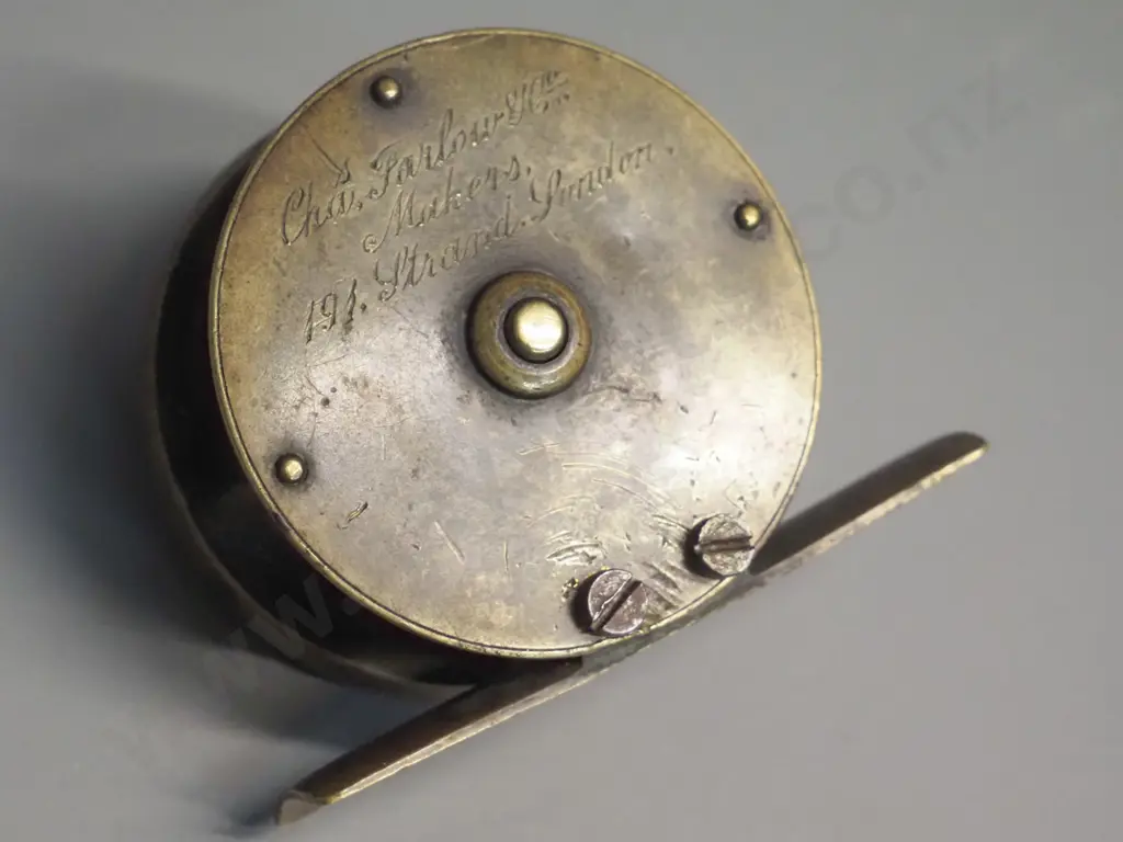 small brass fishing reel marked Chas. Farlow, 191 Strand, London - circa 1890 according to label - diameter 55 Image 1++