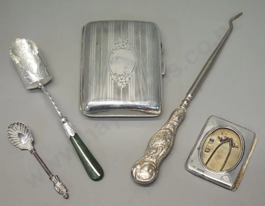 5 sterling silver items - cigarette case 85 x 65, sugar scoop w/ greenstone handle, small figural mustard spoon, button Image 1++