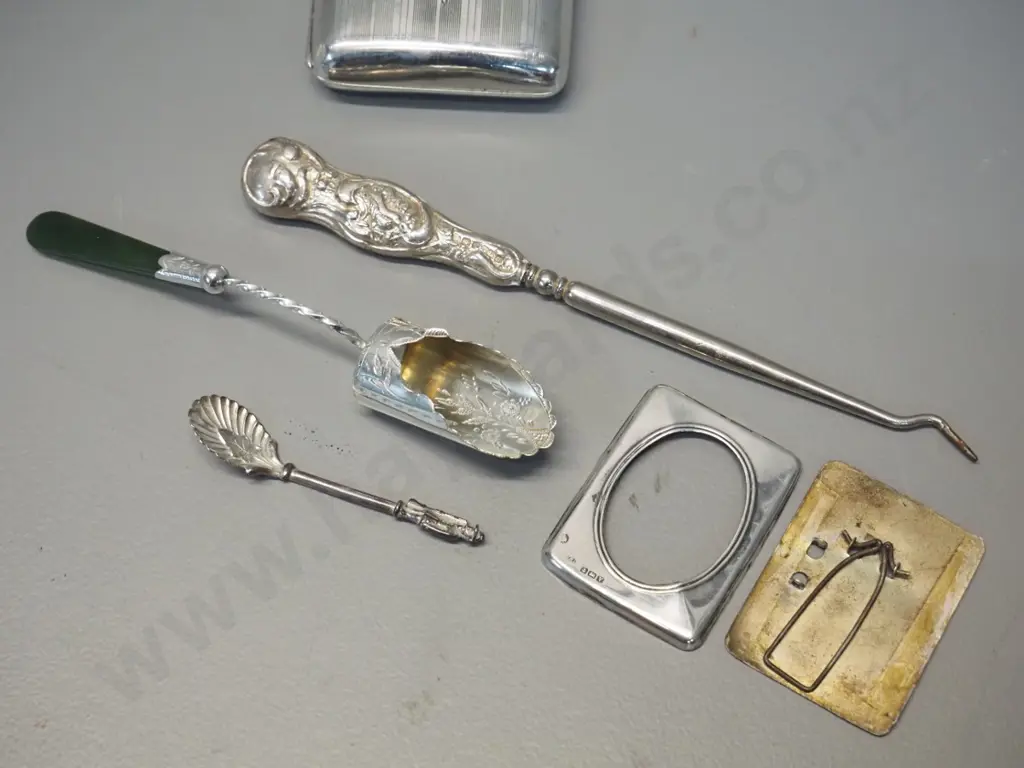 5 sterling silver items - cigarette case 85 x 65, sugar scoop w/ greenstone handle, small figural mustard spoon, button Image 1++
