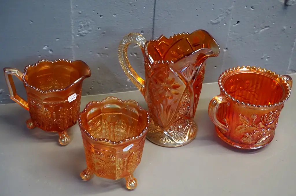 4 pieces marigold colour carnival glass - 2 jugs, vase and double handled pot, larger jug is H-190 W-160 Image 1++