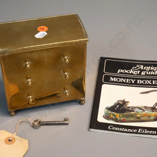 vintage brass money box in the shape of a 4-drawer chest, with key H120 W120 D70 & small book on antique money boxes