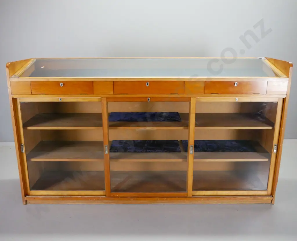 large kauri shop display cabinet with sloping glass top w/3 access flaps & 3 sliding doors in base, all lockable, with Image 1++