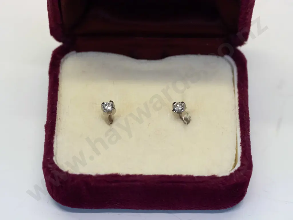 diamond stud earrings stamped 18ct Image 1++