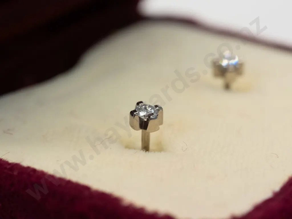 diamond stud earrings stamped 18ct Image 1++