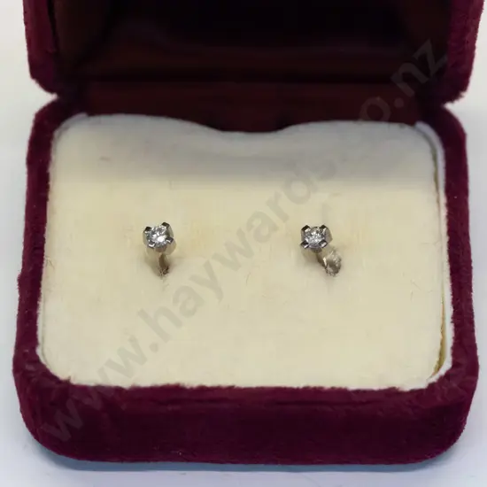 diamond stud earrings stamped 18ct