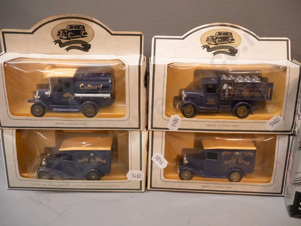 assorted die cast model vehicles - most are Cadbury delivery trucks, larger is a coin bank, 2 others Image 1++