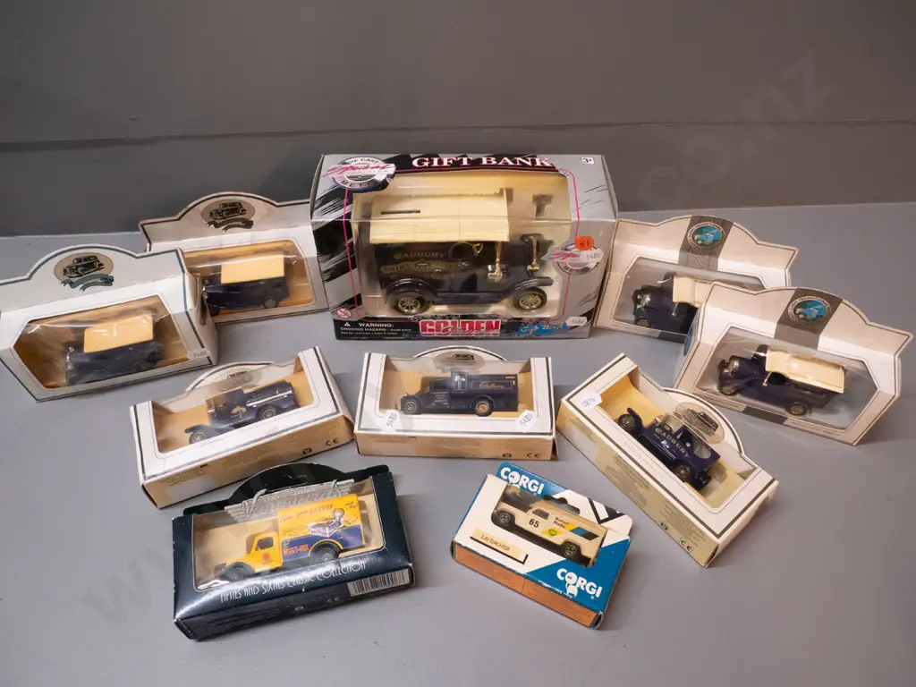 assorted die cast model vehicles - most are Cadbury delivery trucks, larger is a coin bank, 2 others Image 1++