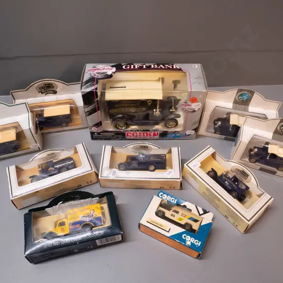 assorted die cast model vehicles - most are Cadbury delivery trucks, larger is a coin bank, 2 others