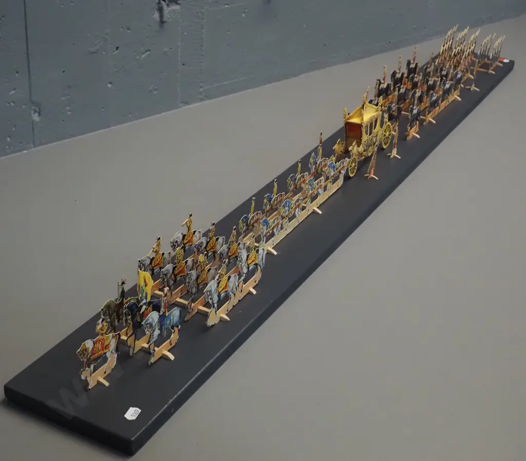 paper cut-out set of the 1953 Coronation procession of Queen Elizabeth II - mounted with wooden supports to a painted Image 1++