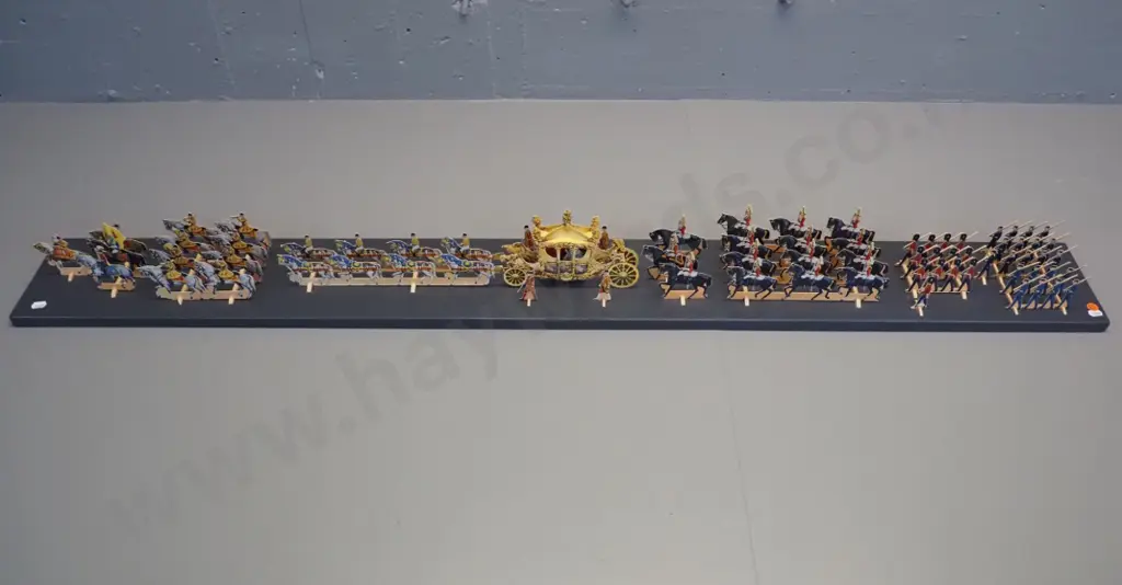 paper cut-out set of the 1953 Coronation procession of Queen Elizabeth II - mounted with wooden supports to a painted Image 1++