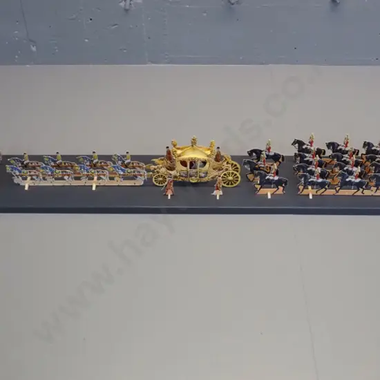 paper cut-out set of the 1953 Coronation procession of Queen Elizabeth II - mounted with wooden supports to a painted