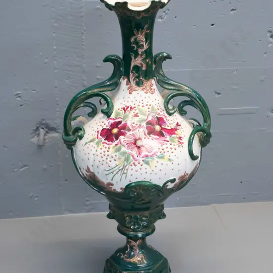 Victorian hand-painted floral motif handled vase - some flecks around base, putty residue around top rim H500