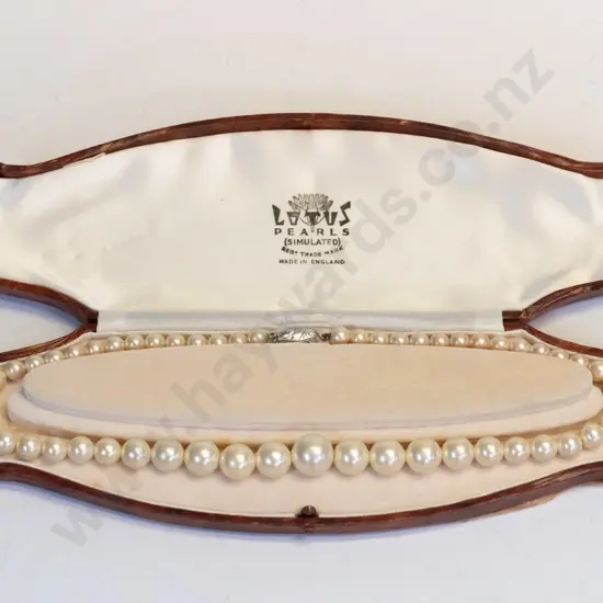 cased Lotus simulated, pearls clasp stamped silver