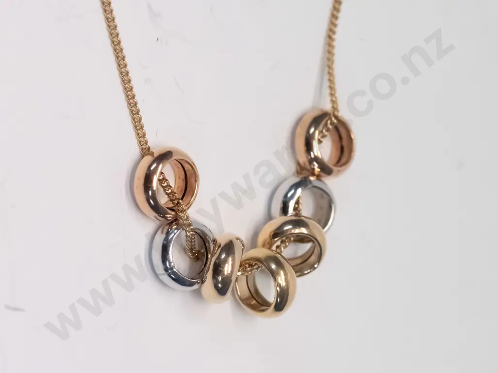 gold necklace with 7 rings stamped 375 Image 1++