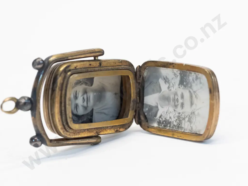 locket with dark stone on swing hinge no chain Image 1++