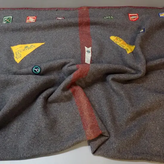 wool girl guide's blanket with assorted patches, one dated 1980 L-2080 W-1430