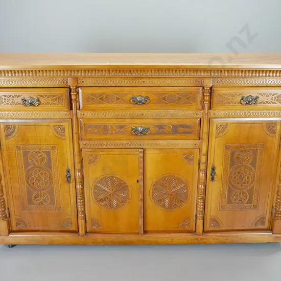 antique kauri sideboard, circa 1890, 4 doors and 4 drawers w/ mission-carved fronts. original brass handles, with key