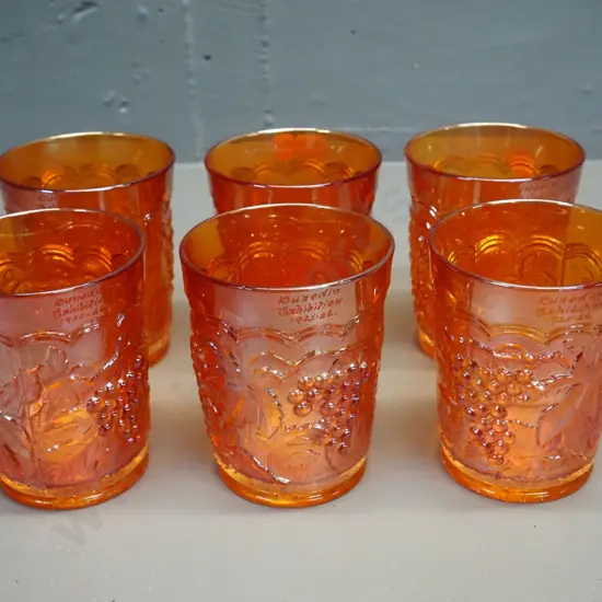 set of 6 marigold colour carnival glass grape pattern water glasses, each engraved with Dunedin Exhibition 1925-26