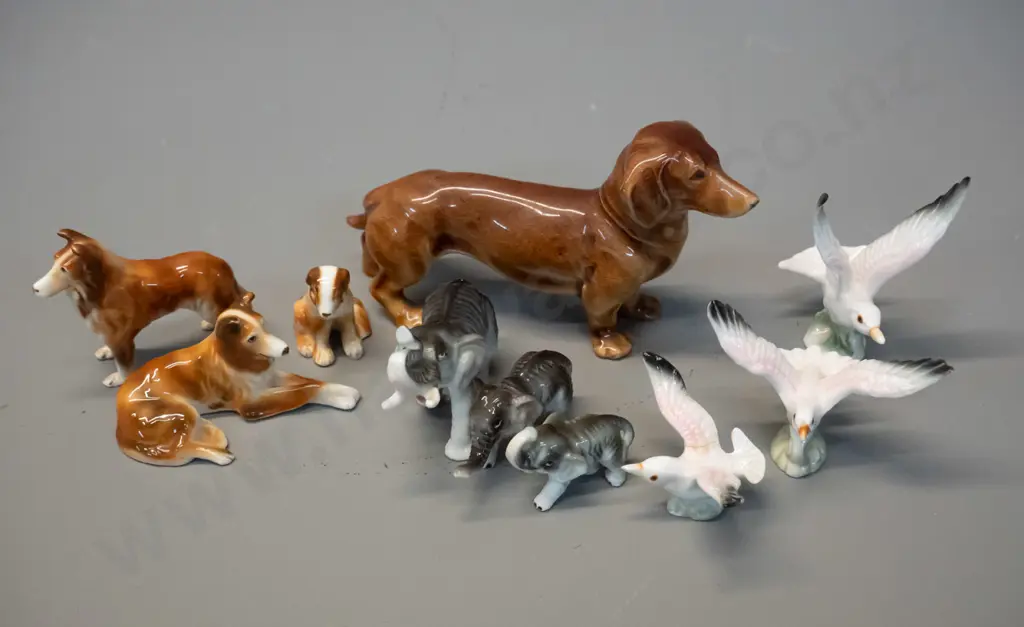 assorted small fine porcelain animal figurines - dogs, birds, elephant, etc. - dachshund is H-65 L-120 Image 1++