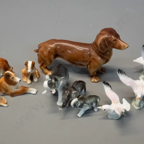 assorted small fine porcelain animal figurines - dogs, birds, elephant, etc. - dachshund is H-65 L-120