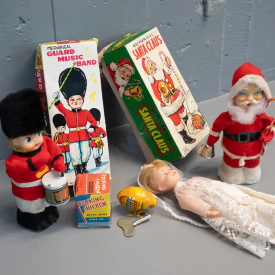 3 retro mechanical toys in original boxes and a small plastic bridal doll H-210. Santa Claus not working,