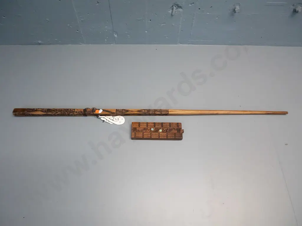 hand carved timber Maori motif "talking stick" & carved bone tiki with paua inset, L1040 & a cribbage board with paua Image 1++