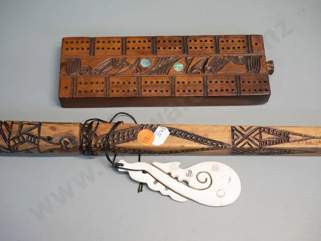 hand carved timber Maori motif "talking stick" & carved bone tiki with paua inset, L1040 & a cribbage board with paua Image 1++