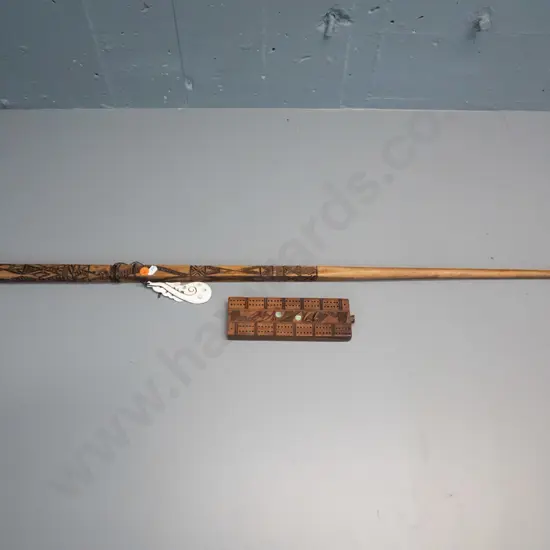 hand carved timber Maori motif "talking stick" & carved bone tiki with paua inset, L1040 & a cribbage board with paua