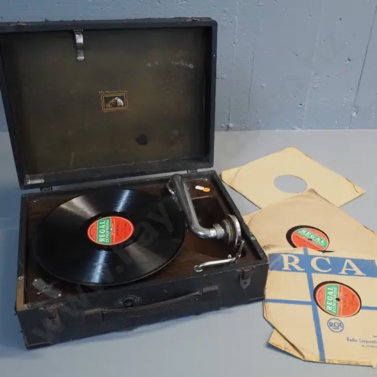 vintage HMV portable wind-up gramophone with 3 Zonohpone Australia records - working but some wear & damage to case,
