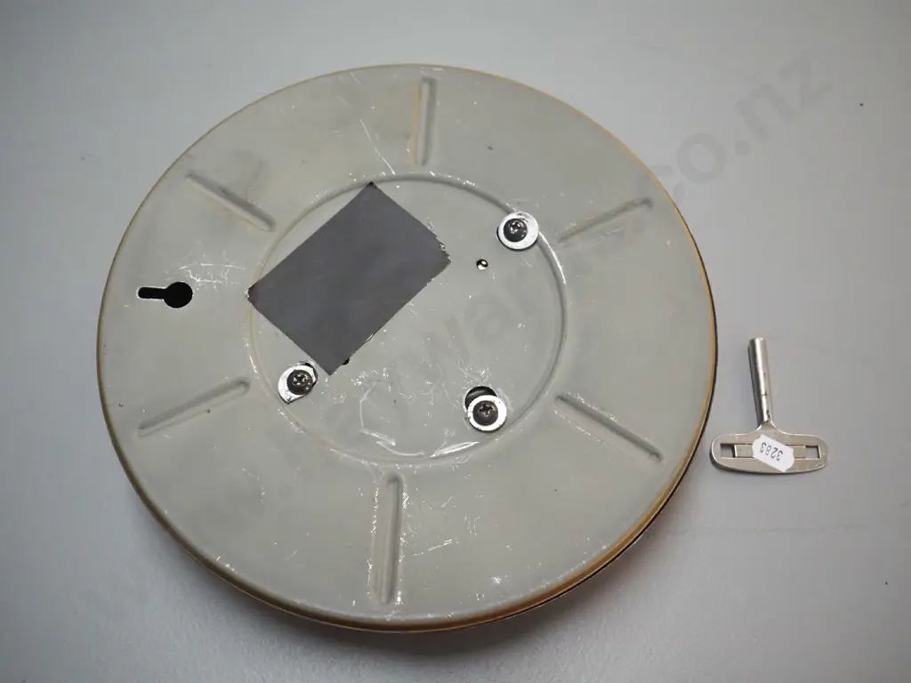 Schatz metal cased wall clock with brass trim, faux wood finish, with key, D-230 - not working, spring broken Image 1++