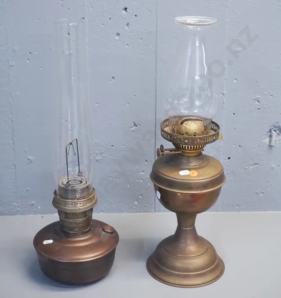 2 vintage kerosene lamps, one brass and one copper & brass, both with chimneys, one w/small chip to base H-480 Image 1++