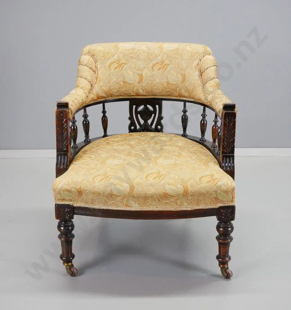Edwardian dark-stained timber tub chair with turned spindles, porcelain casters, gold patterned brocade w/corded detail Image 1++