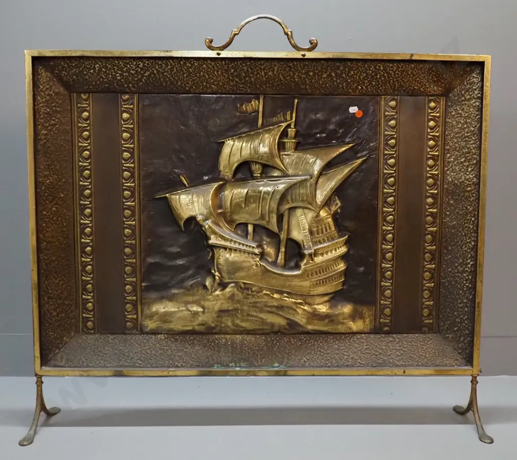 deco beaten brass galleon motif large fire screen with scroll handles and feet, some verdigris. Marked Myttons, Made in Image 1++