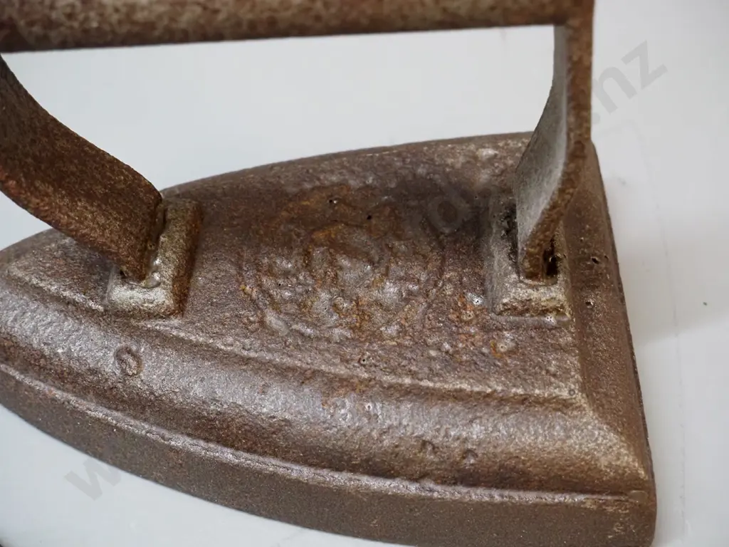 3 cast iron items - 2 sad irons and a collar & cuff iron, no maker's mark - unreadable marks, larger is Image 1++