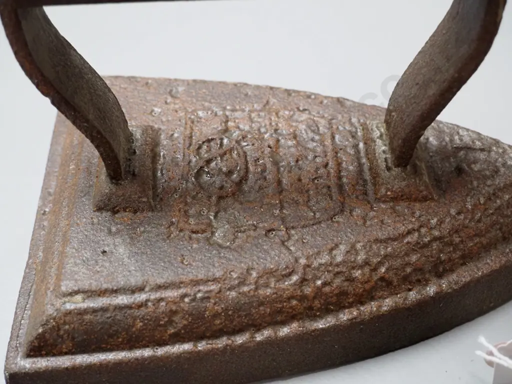 3 cast iron items - 2 sad irons and a collar & cuff iron, no maker's mark - unreadable marks, larger is Image 1++