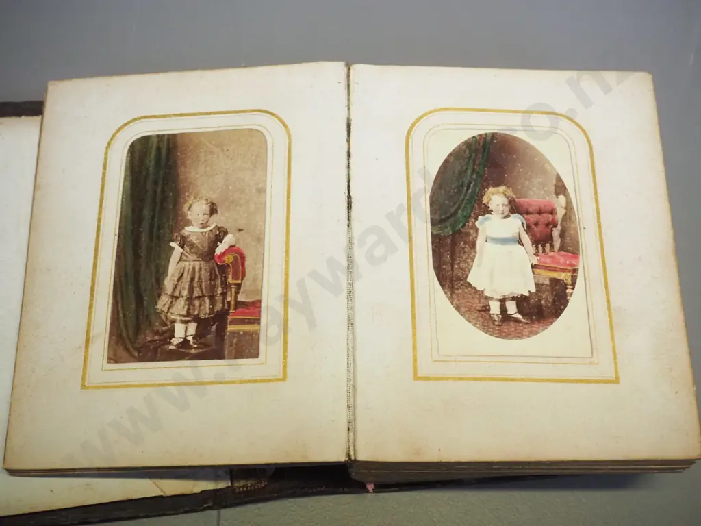 Victorian photo album with numerous photos, no dates or names, in tooled leather album, coming apart slightly H155 W115 Image 1++